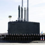 
              Members of the U.S. Navy stand on the USS Delaware, Virginia-class fast-attack submarine, during a commissioning ceremony at the Port of Wilmington in Wilmington, Del., Saturday, April 2, 2022. (AP Photo/Carolyn Kaster)
            