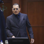 
              Actor Johnny Depp arrives in the courtroom at the Fairfax County Circuit Court in Fairfax, Va., Thursday, April 21, 2022. Actor Johnny Depp sued his ex-wife Amber Heard for libel in Fairfax County Circuit Court after she wrote an op-ed piece in The Washington Post in 2018 referring to herself as a "public figure representing domestic abuse." (Jim Lo Scalzo/Pool Photo via AP)
            