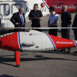 
              British Prime Minister Boris Johnson looks at a drone for surveillance and rescue of migrants, as he meets crews and technical staff, at Lydd Airport, south east England, Thursday, April 14, 2022. Britain says it has struck a deal with Rwanda to send some asylum-seekers to the central African country, a proposal that has been condemned by opposition politicians and refugee groups. (AP Photo/Matt Dunham, Pool)
            