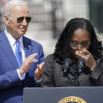 
              Judge Ketanji Brown Jackson tears up as she speaks during an event on the South Lawn of the White House in Washington, Friday, April 8, 2022, celebrating the confirmation of Jackson as the first Black woman to reach the Supreme Court. President Joe Biden listens at left. (AP Photo/Andrew Harnik)
            