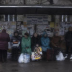 
              Women wait at a bus station in Kramatorsk, Ukraine, Thursday, April 14, 2022. (AP Photo/Petros Giannakouris)
            