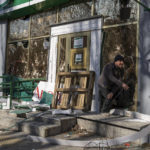 
              A man exits a damaged pharmacy following a bombing, last day, that killed nine civilians, in Mykolaiv Ukraine, Tuesday, April 5, 2022. (AP Photo/Petros Giannakouris)
            