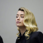 
              Actress Amber Heard listens in the courtroom at the Fairfax County Circuit Court in Fairfax, Va., Monday April 18, 2022. Actor Johnny Depp sued his ex-wife Amber Heard for libel in Fairfax County Circuit Court after she wrote an op-ed piece in The Washington Post in 2018 referring to herself as a "public figure representing domestic abuse." (AP Photo/Steve Helber, Pool)
            