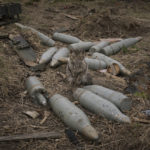 
              A cat sits between large caliber rounds of ammunition abandoned by retreating Russian forces or retrieved from destroyed fighting vehicles in the village of Andriivka, Ukraine, heavily affected by fighting between Russian and Ukrainian forces, Wednesday, April 6, 2022. Several buildings in the village were reduced to mounds of bricks and corrugated metal and residents struggle without heat, electricity or cooking gas. (AP Photo/Vadim Ghirda)
            