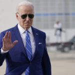 
              President Joe Biden waves as he walks to speaks to reporters before boarding Air Force One at Des Moines International Airport, in Des Moines Iowa, Tuesday, April 12, 2022, en route to Washington. Biden said that Russia's war in Ukraine amounted to a "genocide," accusing President Vladimir Putin of trying to "wipe out the idea of even being a Ukrainian."(AP Photo/Carolyn Kaster)
            