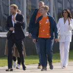 
              Prince Harry and Meghan Markle, Duke and Duchess of Sussex, arrive at the Invictus Games venue in The Hague, Netherlands, Friday, April 15, 2022. The week-long games for active servicemen and veterans who are ill, injured or wounded opens Saturday, April 16, 2022, in this Dutch city that calls itself the global center of peace and justice. (AP Photo/Peter Dejong)
            