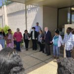 
              Opponents of a grain elevator proposed to be built along the Mississippi River between New Orleans and Baton Rouge pray outside a courthouse in Edgard, La. on Thursday, April 28, 2022 after a hearing connected to their case. (AP Photo/Rebecca Santana)
            