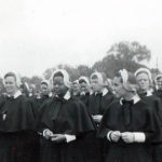
              This 1956 photo provided by Shannen Dee Williams shows Sister Cora Marie Billings, center, who as a 17-year-old in 1956 became the first Black person admitted into the Sisters of Mercy in Philadelphia. Later, she was the first Black nun to teach in a Catholic high school in Philadelphia and was a co-founder of the National Black Sisters' Conference. (Courtesy Sister Cora Marie Billings/Shannen Dee Williams via AP)
            