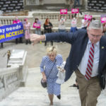 
              State Rep. Randy Bridges, R-Paducah, gives a thumbs down as protesters chant "Bans off our bodies" at the Kentucky state Capitol on Wednesday, April 13, 2022. Demonstrators' chants echoed through Kentucky's Capitol as Republican lawmakers started pushing aside the Democratic governor's veto of a bill putting new restrictions on abortion. (Ryan C. Hermens/Lexington Herald-Leader via AP)
            