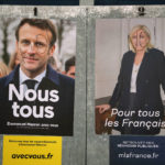 
              Presidential campaign posters of French President and centrist candidate for reelection Emmanuel Macron, left, and French far-right presidential candidate Marine Le Pen, in Salies de Bearn, southwestern France, Saturday, April 23, 2022. French President Emmanuel Macron is facing off against far-right challenger Marine Le Pen in France's April 24 presidential runoff. (AP Photo/Bob Edme)
            