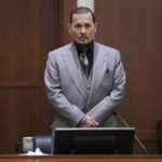 
              Actor Johnny Depp takes the stand during a hearing in the courtroom at the Fairfax County Circuit Court in Fairfax, Va., Wednesday, April 20, 2022. Actor Johnny Depp sued his ex-wife Amber Heard for libel in Fairfax County Circuit Court after she wrote an op-ed piece in The Washington Post in 2018 referring to herself as a "public figure representing domestic abuse." (Evelyn Hockstein/Pool via AP)
            