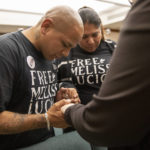 
              John Lucio, with his wife, Michelle Lucio, prays with Jennifer Allmon, right, Executive Director of the Texas Catholic Conference of Bishops, before a hearing by the Interim Study Committee on Criminal Justice Reform about his mother, death row inmate Melissa Lucio, at the Capitol, in Austin, Texas, on Tuesday, April 12, 2022. A bipartisan majority of the Texas House of Representatives is calling for clemency for Melissa Lucio who was convicted of capital murder in 2008 after the death of her daughter. (Jay Janner/Austin American-Statesman via AP)
            