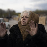 
              Valentina Greenchuck, 73, gestures after arriving from Mariupol at a refugee center in Zaporizhzhia, Ukraine, Thursday, April 21, 2022, after fleeing from the Russian attacks. Mariupol, which is part of the industrial region in eastern Ukraine known as the Donbas, has been a key Russian objective since the Feb. 24 invasion began. (AP Photo/Leo Correa)
            