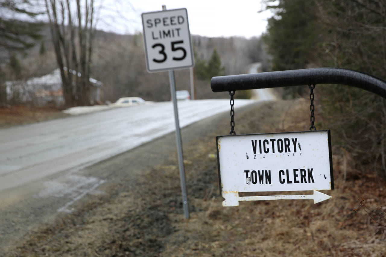 A sign with an arrow points toward the Victory, Vt., Town Clerk's Office, Thursday March 31, 2022. ...