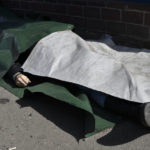 
              A body lies covered after Russian shelling at the railway station in Kramatorsk, Ukraine, Friday, April 8, 2022. Hours after warning that Ukraine's forces already had found worse scenes of brutality in a settlement north of Kyiv, President Volodymyr Zelenskyy said that "thousands" of people were at the station in Kramatorsk, a city in the eastern Donetsk region, when it was hit by a missile. (AP Photo/Andriy Andriyenko)
            