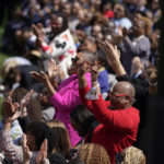 
              People applaud as Vice President Kamala Harris, accompanied by President Joe Biden and Judge Ketanji Brown Jackson, speaks during an event on the South Lawn of the White House in Washington, Friday, April 8, 2022, celebrating the confirmation of Jackson as the first Black woman to reach the Supreme Court. (AP Photo/Andrew Harnik)
            