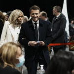 
              French President and centrist presidential candidate for reelection Emmanuel Macron and his wife Brigitte Macron wait before voting for the first round of the presidential election, Sunday, April 10, 2022 in Le Touquet, northern France. Polls opened across France for the first round of the country's presidential election, where up to 48 million eligible voters will be choosing between 12 candidates. President Emmanuel Macron is seeking a second five-year term, with a strong challenge from the far right. (AP Photo/Thibault Camus, Pool)
            