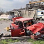 
              A body of a civilian lies next to a damaged car near the Illich Iron & Steel Works Metallurgical Plant, the second largest metallurgical enterprise in Ukraine, in an area controlled by Russian-backed separatist forces in Mariupol, Ukraine, Saturday, April 16, 2022. Mariupol, a strategic port on the Sea of Azov, has been besieged by Russian troops and forces from self-proclaimed separatist areas in eastern Ukraine for more than six weeks. (AP Photo/Alexei Alexandrov)
            