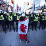 
              A protester confronts police during a demonstration, part of a convoy-style protest participants are calling "Rolling Thunder", Friday, April 29, 2022, in Ottawa. (Sean Kilpatrick/The Canadian Press via AP)
            