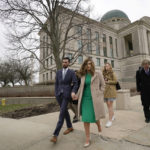 
              Democrat Abby Finkenauer leaves the Iowa Supreme Court Building with her husband Daniel Wasta, Wednesday, April 13, 2022, in Des Moines, Iowa. The Iowa Supreme Court has ruled that  Finkenauer qualifies for the primary ballot, rejecting a lower court decision and allowing her to continue her campaign for the nomination. The court’s decision Friday, April 15, leaves Finkenauer as the likely front-runner in a race with two lesser-known candidates ahead of Iowa’s June 7 primary.   (AP Photo/Charlie Neibergall)
            