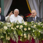 
              Pope Francis, center, with, from left, Malta Prime Minister Robert Abela, his daughter Giorgia Mae, Malta's President George William Vella and his wife Miriam, waves to a cheering crowd from a balcony of the Grand Master's Palace in Valletta, Malta, Saturday, April 2, 2022. Pope Francis headed to the Mediterranean island nation of Malta on Saturday for a pandemic-delayed weekend visit, aiming to draw attention to Europe's migration challenge that has only become more stark with Russia's invasion of Ukraine. (AP Photo/Andrew Medichini)
            