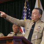 
              Los Angeles County Sheriff Alex Villanueva speaks during a news conference, Tuesday, April 26, 2022, in  Los Angeles. Villanueva disputed allegations that he orchestrated a coverup of an incident where a deputy knelt on a handcuffed inmate's head last year. Villanueva, who oversees the nation's largest sheriff's department, also indicated that an Los Angeles Times reporter is under criminal investigation after she first reported the incident with the inmate. (AP Photo/Damian Dovarganes)
            