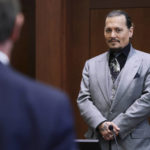
              Actor Johnny Depp looks on at the end of the second day of his testimony in the courtroom at the Fairfax County Circuit Court in Fairfax, Va., Wednesday, April 20, 2022. Depp sued his ex-wife Amber Heard for libel in Fairfax County Circuit Court after she wrote an op-ed piece in The Washington Post in 2018 referring to herself as a "public figure representing domestic abuse." (Evelyn Hockstein/Pool via AP)
            