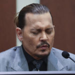 
              Actor Johnny Depp testifies during a hearing in the courtroom at the Fairfax County Circuit Court in Fairfax, Va., Wednesday, April 20, 2022. Actor Johnny Depp sued his ex-wife Amber Heard for libel in Fairfax County Circuit Court after she wrote an op-ed piece in The Washington Post in 2018 referring to herself as a "public figure representing domestic abuse." (Evelyn Hockstein/Pool via AP)
            