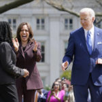 
              President Joe Biden turns to Judge Ketanji Brown Jackson, during an event on the South Lawn of the White House in Washington, Friday, April 8, 2022, celebrating the confirmation of Jackson as the first Black woman to reach the Supreme Court, as Vice President Kamala Harris looks on. (AP Photo/Susan Walsh)
            