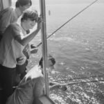 Paul McCartney, John Lennon and Ringo Starr of The Beatles fishing from their hotel room at the Edgewater Inn, Seattle, Washington, 24th August 1964. The Beatles are in Seattle to perform at the Seattle Center Coliseum during their US tour. (Photo by William Lovelace/Express/Getty Images)