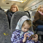 
              People sit in a bus during an evacuation of civilians on a road near Slovyansk, eastern Ukraine, Wednesday, May 4, 2022. (AP Photo/Andriy Andriyenko)
            