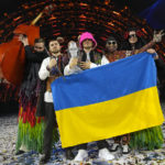 
              Members of the Kalush Orchestra from Ukraine celebrate after winning the Grand Final of the Eurovision Song Contest at Palaolimpico arena, in Turin, Italy, Saturday, May 14, 2022. (AP Photo/Luca Bruno)
            