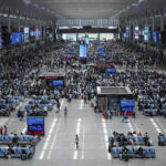 
              Passengers wait for their train at the Hongqiao Railway Station in Shanghai, China Sunday, May 22, 2022. The locked-down Chinese metropolis of Shanghai opens some public transit services as it slowly eases pandemic restrictions that have kept most residents in their housing complexes for more than six weeks. (Chinatopix via AP)
            