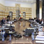 
              In this photo released by Lebanon's official government photographer Dalati Nohra, Lebanese president Michel Aoun, center background, and Lebanese Prime minister Najib Mikati, left background, head a cabinet meeting at the presidential palace, in Baabda, east of Beirut, Lebanon, Friday, May 20, 2022. Lebanon's government approved an economic recovery plan during its last meeting Friday before becoming a caretaker Cabinet after a new parliament was elected over the weekend, the information minister said. (Dalati Nohra/Lebanon Government via AP)
            