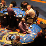 
              Gamblers play cards at the Ocean Casino Resort in Atlantic City, N.J., Feb. 10, 2022. The American Gaming Association said Wednesday, May 11, 2022, that America's commercial casinos had their best month ever in March 2022, winning $5.3 billion from gamblers. (AP Photo/Wayne Parry)
            