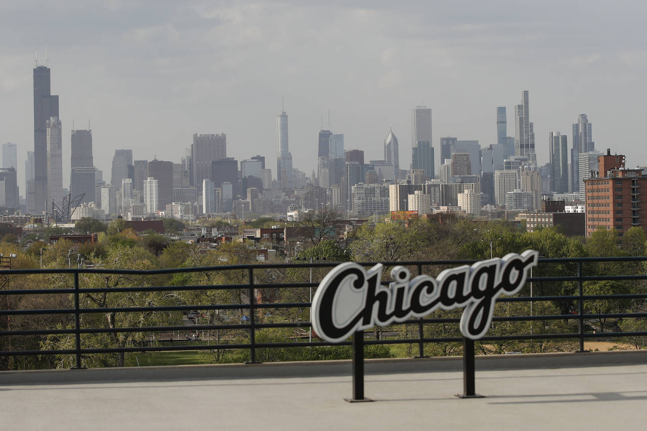 FILE - Chicago's skyline is seen from the Guaranteed Rate Field before a baseball game between the ...