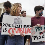 
              Demonstrators protest outside of the U.S. Supreme Court, Thursday, May 5, 2022, in Washington. A draft opinion suggests the U.S. Supreme Court could be poised to overturn the landmark 1973 Roe v. Wade case that legalized abortion nationwide, according to a Politico report released Monday. Whatever the outcome, the Politico report represents an extremely rare breach of the court's secretive deliberation process, and on a case of surpassing importance. (AP Photo/Mariam Zuhaib)
            