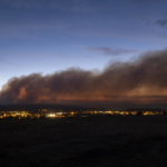 
              Smoke from the Calf Canyon/Hermits Peak Fire drifts over Las Vegas, N.M., on Saturday, May 7, 2022. (Robert Browman/The Albuquerque Journal via AP)
            