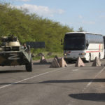 
              Buses with Ukrainian servicemen evacuated from the besieged Mariupol's Azovstal steel plant travel accompanied by Russian APC's to a prison in Olyonivka, territory under the government of the Donetsk People's Republic, eastern Ukraine, Tuesday, May 17, 2022. More than 260 fighters, some severely wounded, were pulled from a steel plant on Monday that is the last redoubt of Ukrainian fighters in the city and transported to two towns controlled by separatists, officials on both sides said. (AP Photo)
            