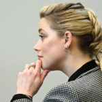 
              Actor Amber Heard listens in the courtroom at the Fairfax County Circuit Courthouse in Fairfax, Va., Tuesday, May 24, 2022. Depp sued his ex-wife Amber Heard for libel in Fairfax County Circuit Court after she wrote an op-ed piece in The Washington Post in 2018 referring to herself as a "public figure representing domestic abuse." (Jim Watson/Pool photo via AP)
            