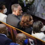 
              Vice President Kamala Harris and her husband Doug Emhoff attend a memorial service for Ruth Whitfield, a victim of the Buffalo supermarket shooting, at Mt. Olive Baptist Church, Saturday, May 28, 2022, in Buffalo, N.Y. Sitting with Harris are Whitfield's daughters Angela Crawley, top left, and Robin Harris. (AP Photo/Patrick Semansky)
            