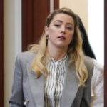
              Actor Amber Heard arrives in the courtroom at the Fairfax County Circuit Courthouse in Fairfax, Va., Monday, May 27, 2022. Actor Johnny Depp sued his ex-wife Amber Heard for libel in Fairfax County Circuit Court after she wrote an op-ed piece in The Washington Post in 2018 referring to herself as a "public figure representing domestic abuse." (AP Photo/Steve Helber, Pool)
            