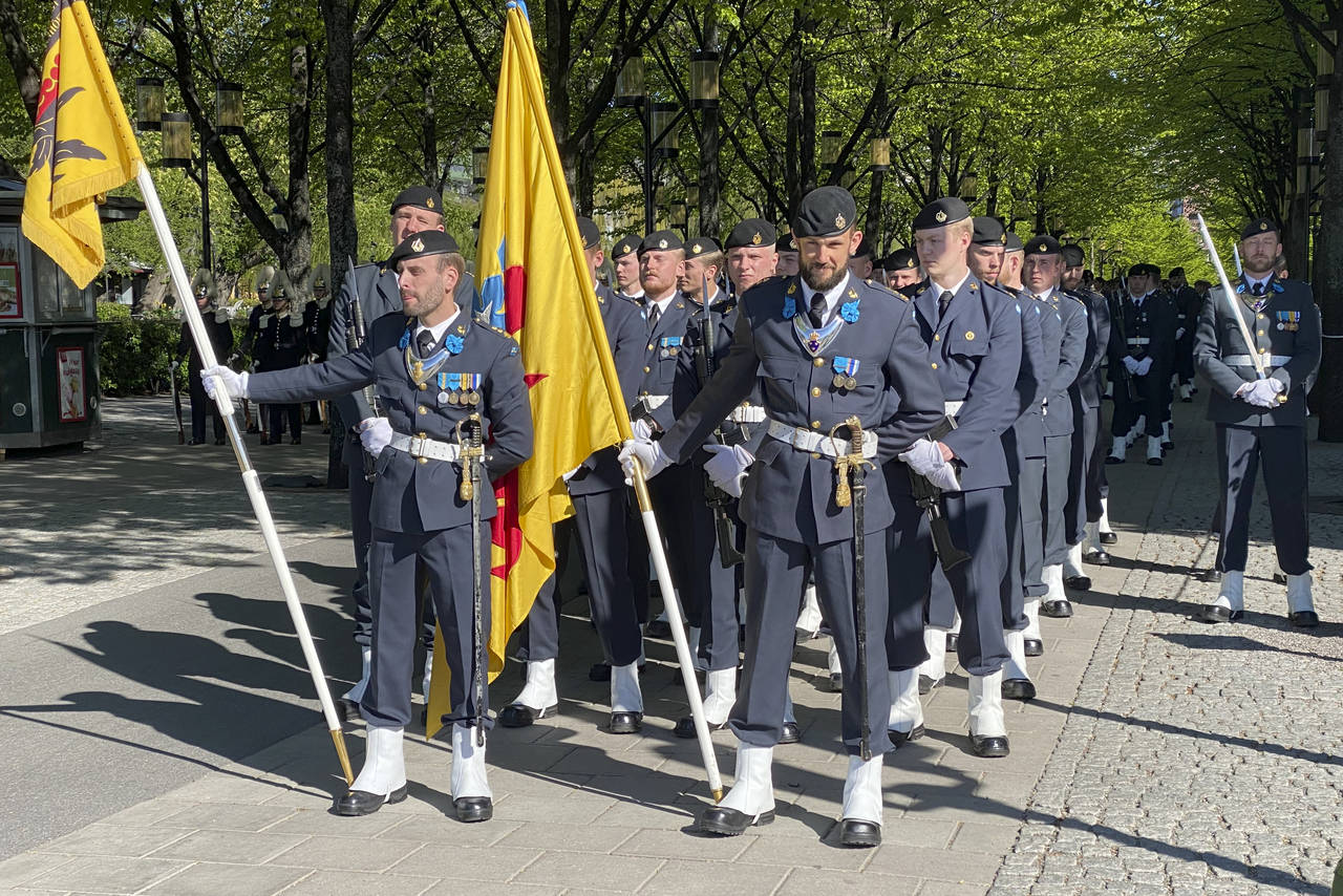 Soldiers from the Swedish Armed Forces stand in formation near the Royal Palace in Stockholm, Swede...