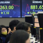 
              A currency trader watches monitors at the foreign exchange dealing room of the KEB Hana Bank headquarters in Seoul, South Korea, Tuesday, May 24, 2022.  Asian shares were mostly lower on Tuesday as worries over inflation tempered optimism over President Joe Biden’s remark that he was considering reducing U.S. tariffs on Chinese imports.(AP Photo/Ahn Young-joon)
            