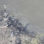 
              In this handout photo provided by the Ukraine Armed Forces Thursday, May 12, 2022, dozens of destroyed or damaged Russian armored vehicles on both banks of Siverskyi Donets River after their pontoon bridges were blown up in eastern Ukraine. (Ukrainian Presidential Press Office via AP)
            