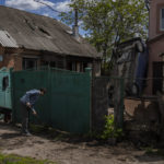 
              Residents clear the rubble from their house damaged during a shelling in Kharkiv, Ukraine, Monday, May 16, 2022. (AP Photo/Bernat Armangue)
            