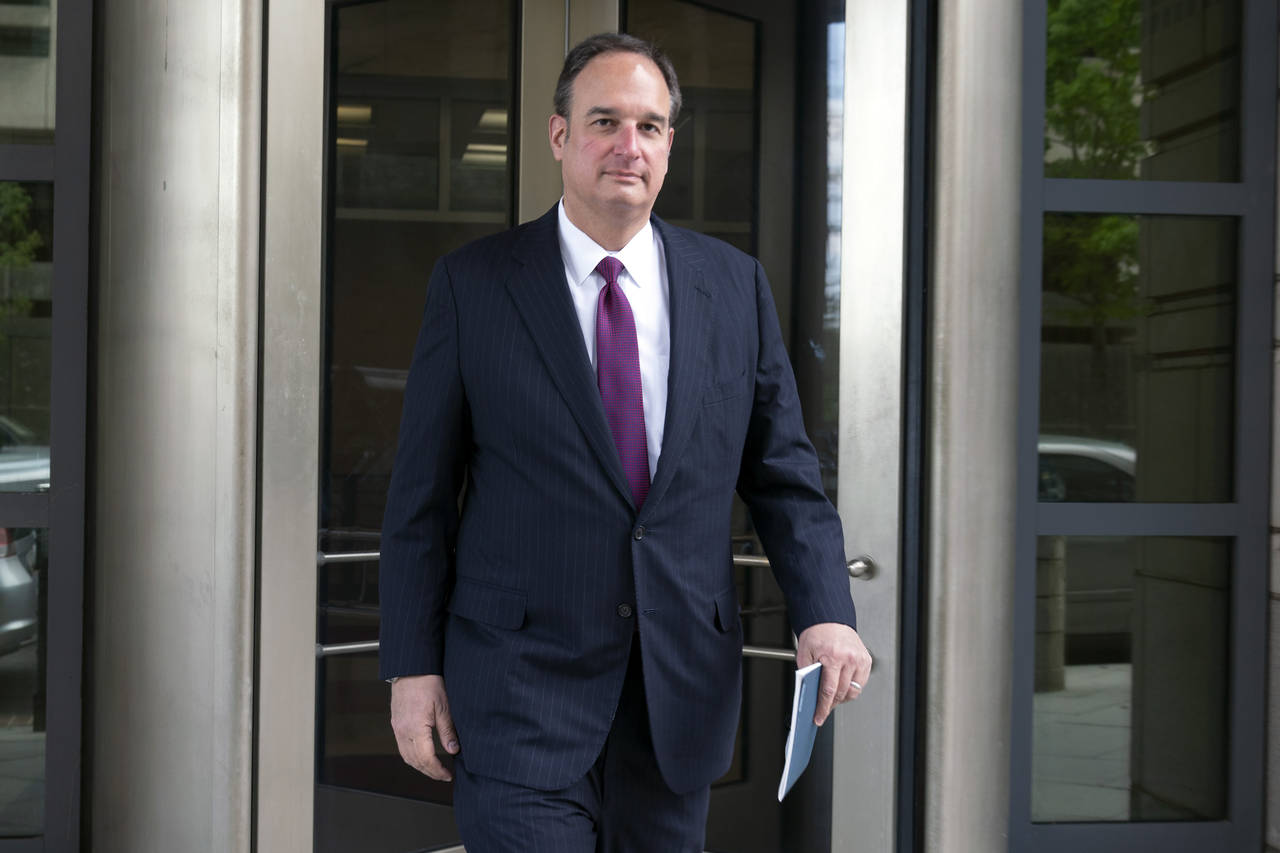 FILE - Attorney Michael Sussmann leaves federal court in Washington, April 27, 2022. A criminal cas...