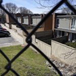 
              Cars are parked in front of a housing complex, in Providence, R.I., Monday, April 11, 2022. The housing complex was built after huge swaths of the 30-acre neighborhood once known as Lippitt Hill, a center of Black life at the foot of the stately homes of the city's elite East Side, were taken by eminent domain in the late 1950s and early 1960s and demolished before the construction of redevelopment projects. (AP Photo/Steven Senne)
            