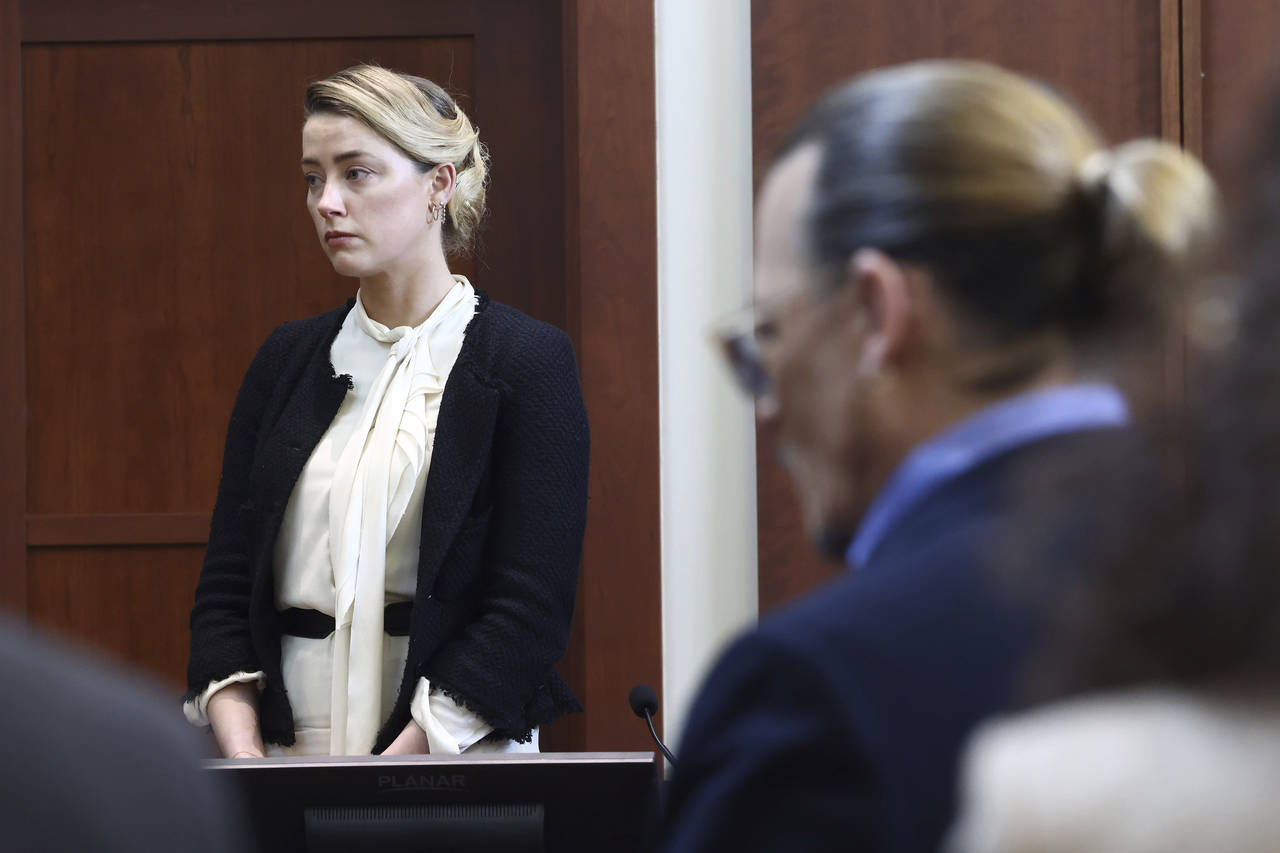 Actor Amber Heard, left, and actor Johnny Depp appear in the courtroom at the Fairfax County Circui...