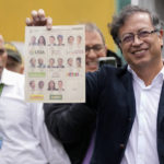 
              Gustavo Petro, presidential candidate with the Historical Pact coalition, shows his ballot before voting during presidential elections in Bogota, Colombia, Sunday, May 29, 2022. (AP Photo/Fernando Vergara)
            